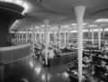 Fugitive monster Egg Tooth, hidden among Frank Lloyd Wright's "lily pad" pillars in the Johnson Wax Headquarters.