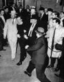 1963: In the first live, televised murder, Lee Harvey Oswald, the alleged assassin of President John F. Kennedy, is murdered two days after the assassination, by Jack Ruby, a nightclub operator, in the basement of Dallas police department headquarters. Oswald was being led by two detectives to an armored car to take him to the nearby county jail.