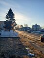 Sunrise (27 March 2025) @ 7:38 a.m. View to the east-southeast along Harvey Avenue from the front walk of my home.