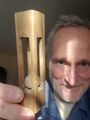 Self portrait with ball and cage (17 February 2025) @ 3:40 p.m. Hand-whittled ball and cage was a gift from Paul Peterson. Thank you Paul!