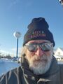 Self portrait with water tower (2 January 2022) @ 3:16 p.m. West side of town, view to the west.