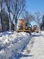 Snow removal (25 February 2025) @ 10:06 a.m. View to the east along Chapman Street from Fifth Avenue East.