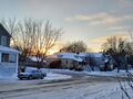 Sunset (18 January 2025) @ 4:23 p.m. View to the west-southwest from the front steps of my home.